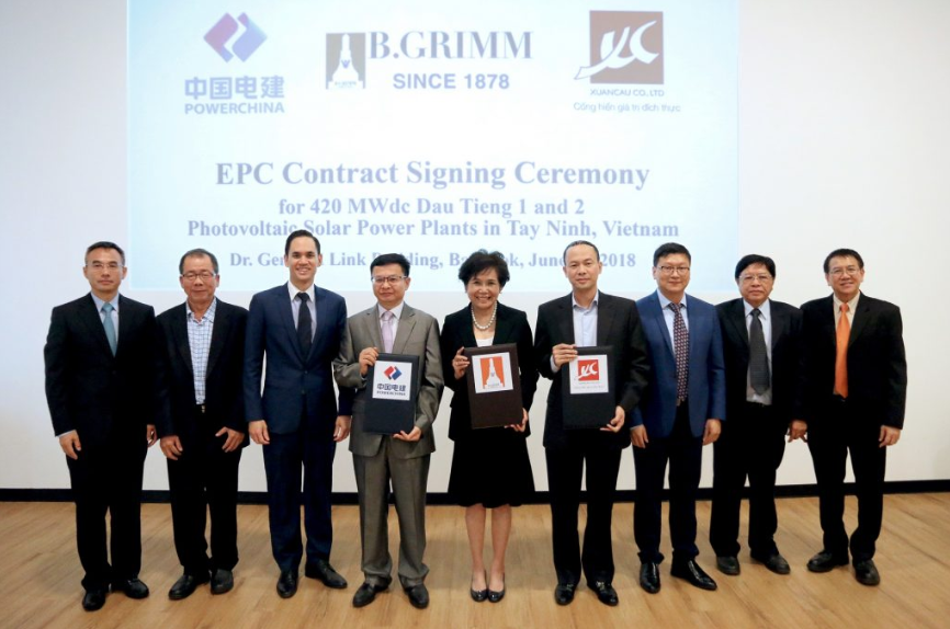Posing at the contract signing ceremony for the US$420-million project is B.Grimm Power President Preeyanart Soontornwata (centre), flanked by PowerChina Executive Vice President Ji Xiaoyong (left) and Xuan Cau CEO Dao Trong Khanh. credit: B. Grimm