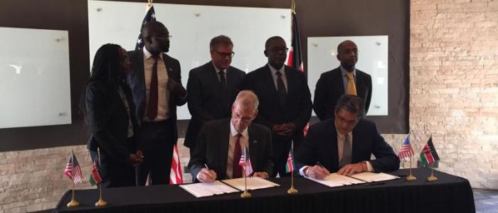 US Ambassador to Kenya, Robert F. Godec, signs the grants on behalf of USTDA, along with Xago managing director, Paul W. Webb. Source: US Trade and Development Agency