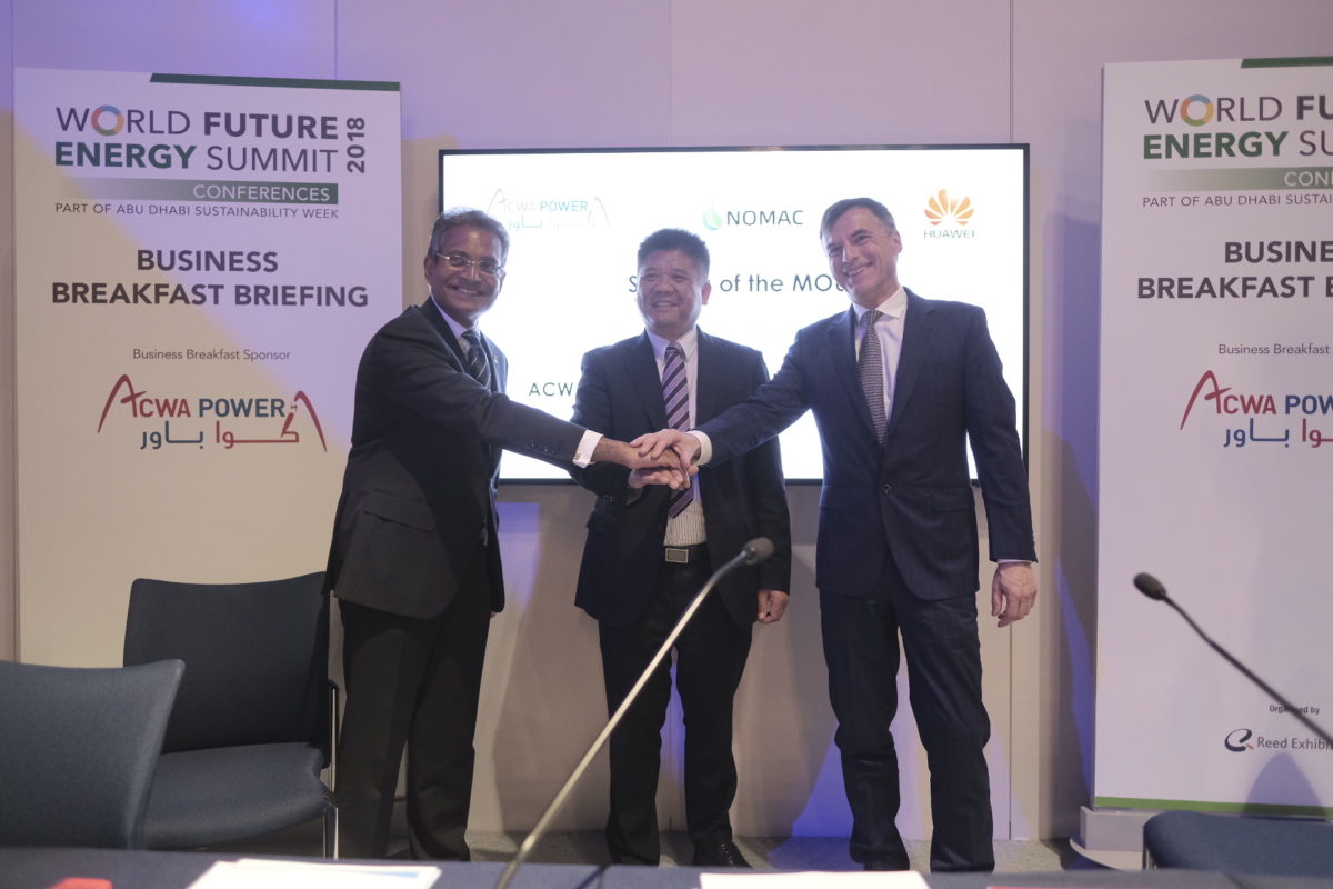 ACWA Power CEO Paddy Padmanathan (left), Yin Feijun, GM of FusionSolar Smart PV Global Sales, Huawei (centre) and Julio Torre Gutierrez, President & CEO of NOMAC. Source: Huawei/ACWA.